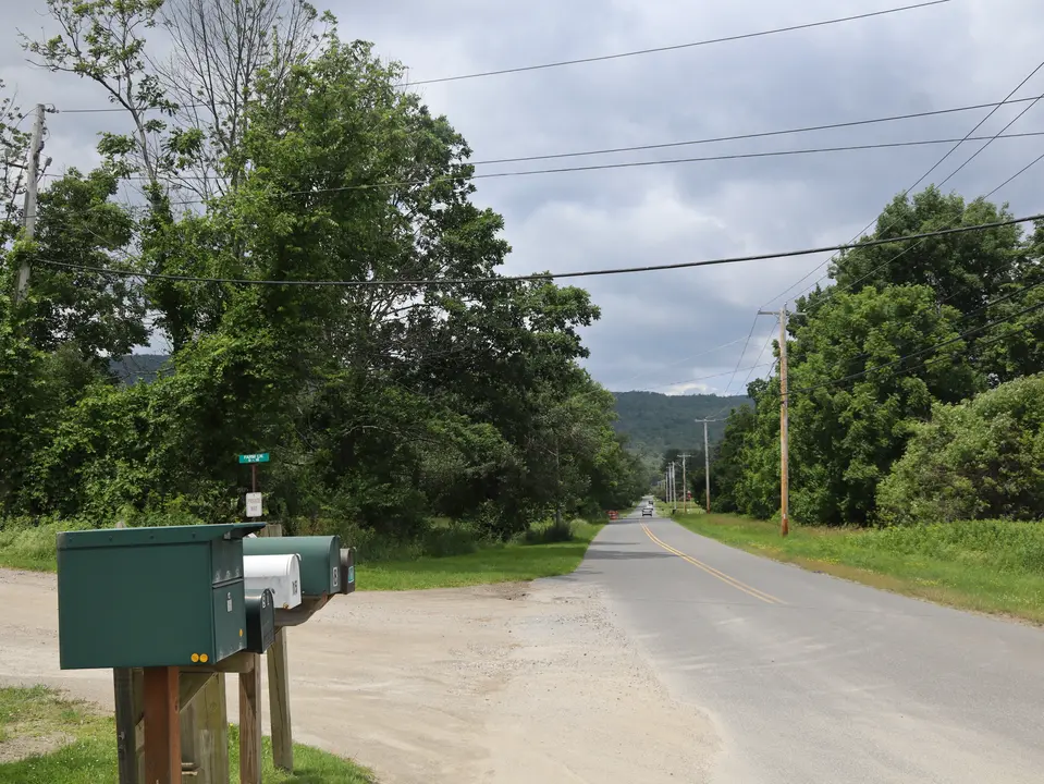 Entrance to the access road that leads to Blue Rider Stables (left), off Jug End Road (right)