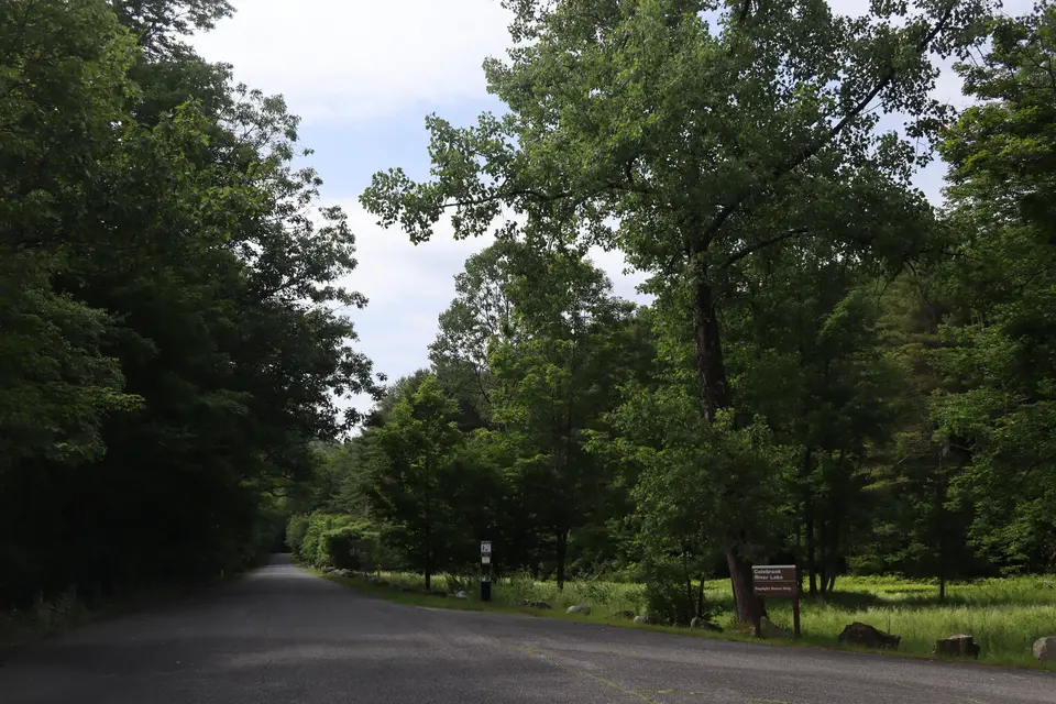 Colebrook River Lake parking area access (right) from Roosterville Road.