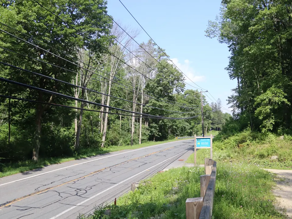 Entrance to the parking area for Donato's Trail, from Route 20 heading West.
