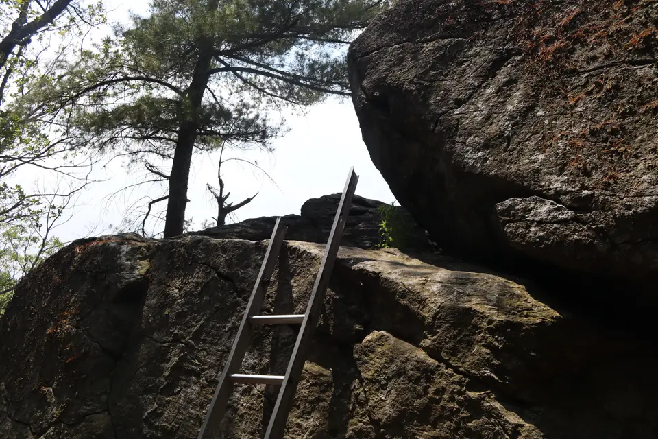A ladder provides access to the top of a rock on East Mountain.