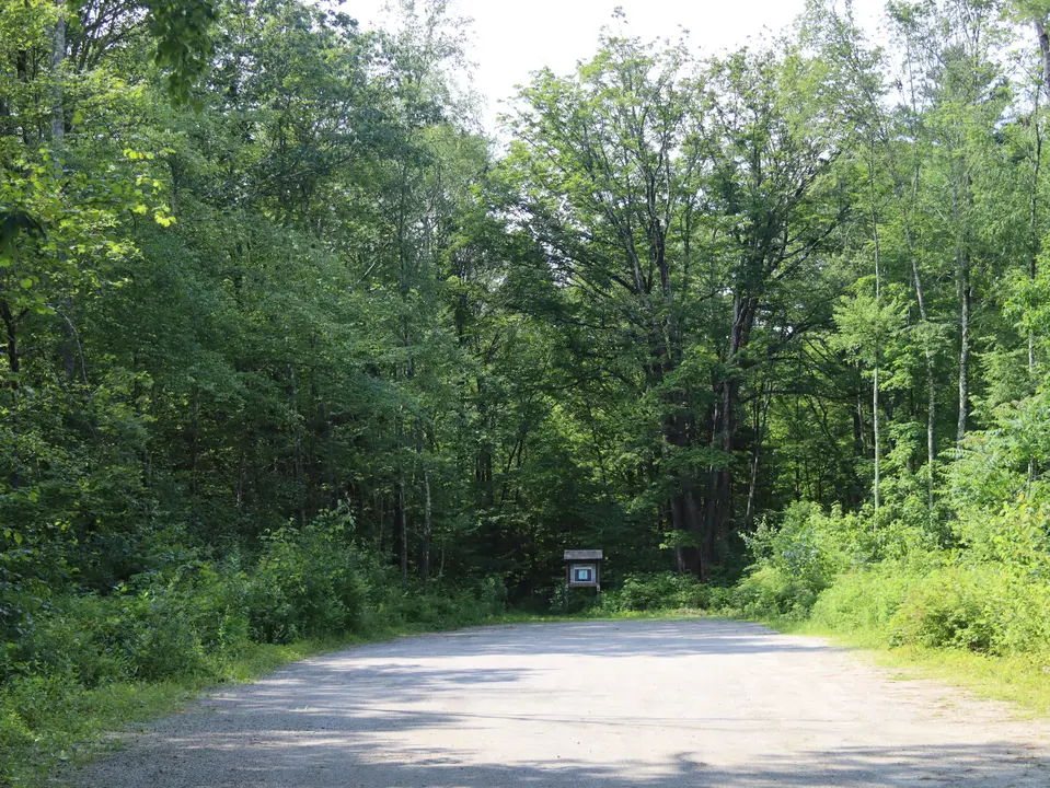 View of the Father Loop parking area facing the trailhead.