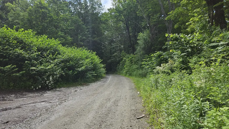 The dirt road leading to the small parking area. Made of similar material