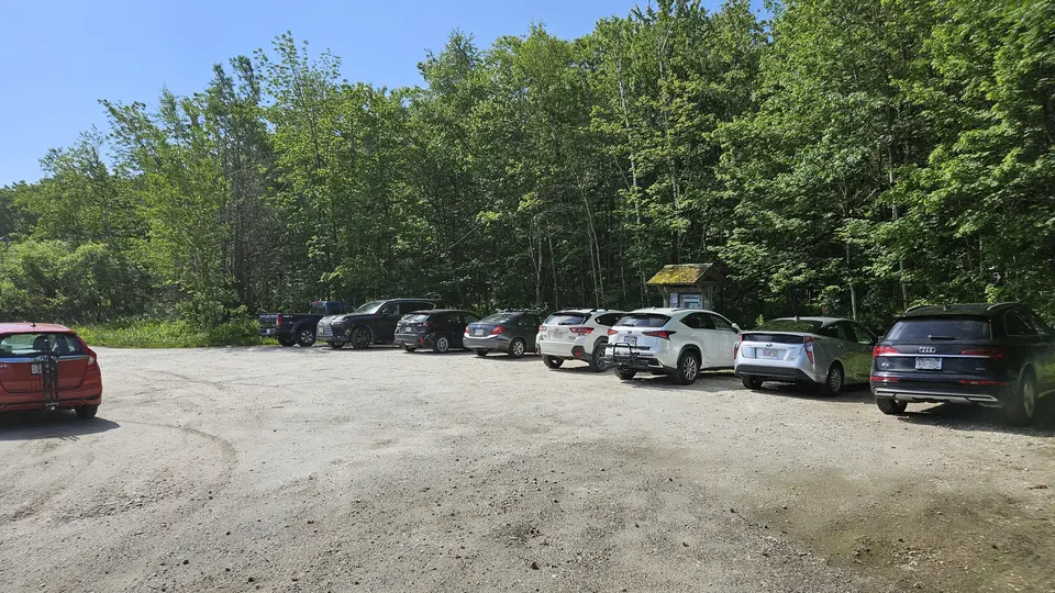 The dirt parking lot.