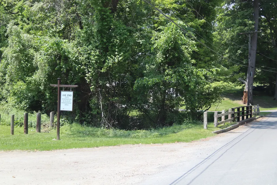 Entrance to Jug End State Reservation parking (left) off of Jug End Road.