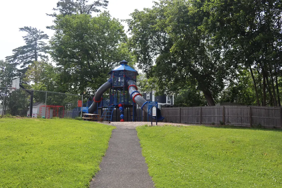 An accessible path leads up to the playground and basketball court from the tennis and pickleball courts.