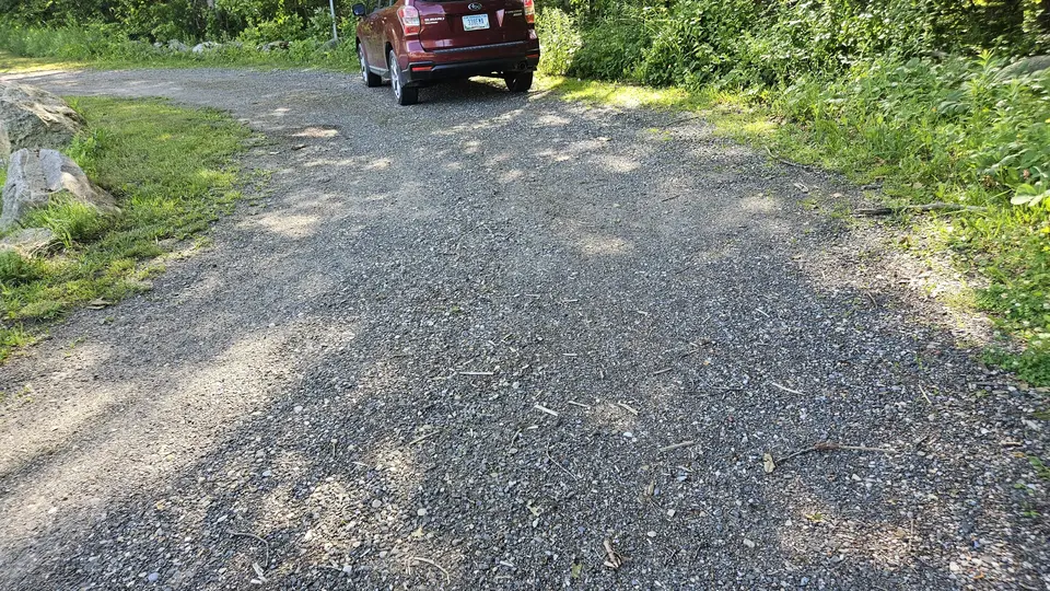 The gravel parking lot.