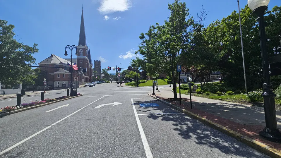 The street and the handicap spots adjacent to the park.