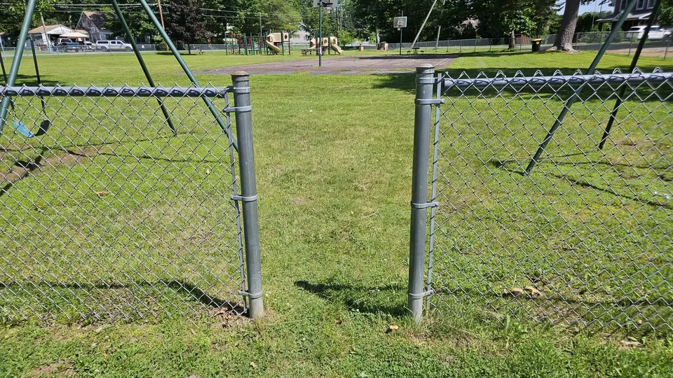 The 2.5' gap in the fence that allows access to the park