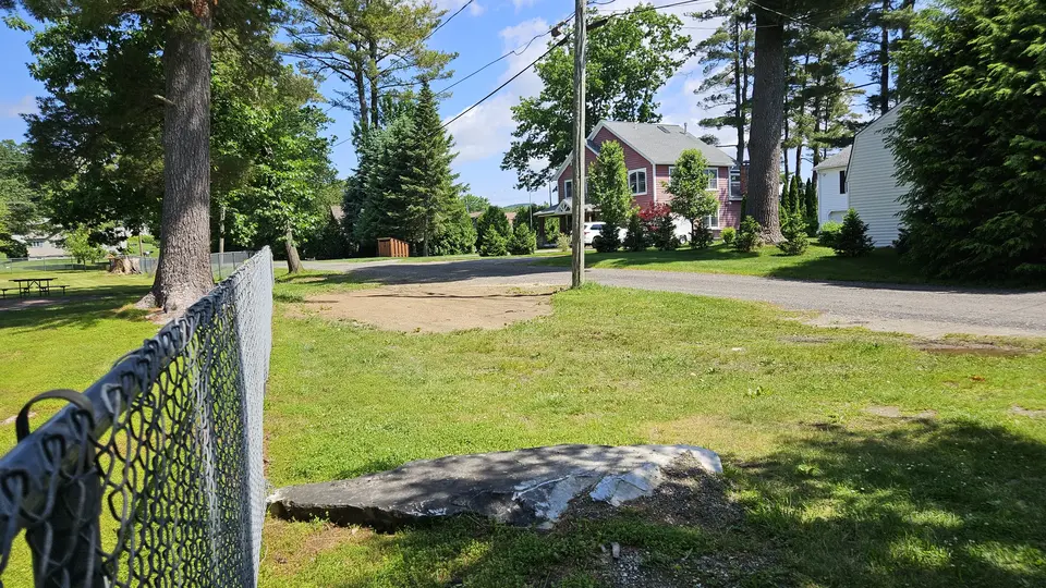 The grass area that can be used for parking
