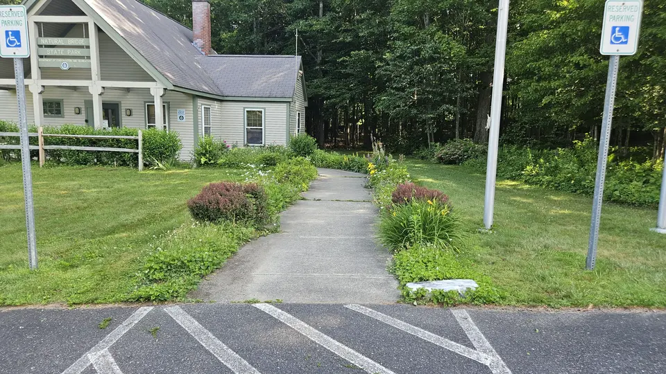 The paved path leading from the parking lot into the visitor center.