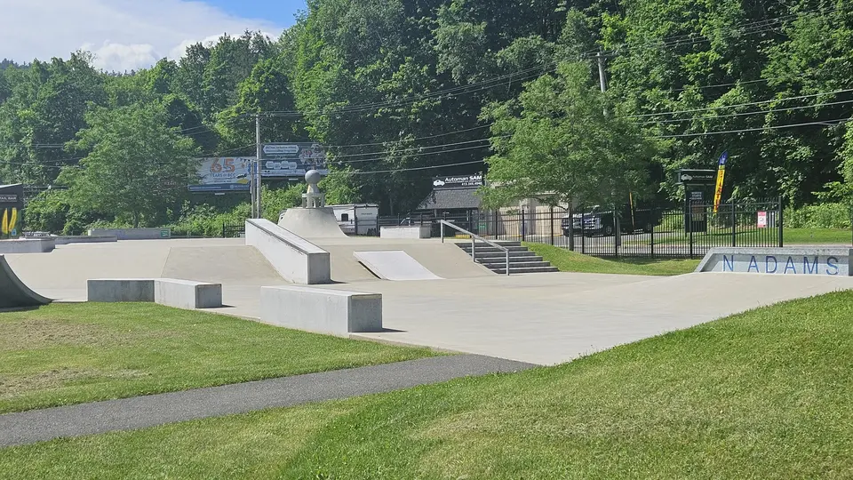 The skate park, connected by a paved path.