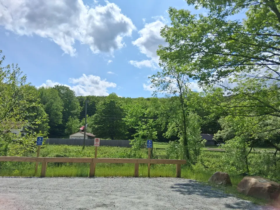 2 accessible parking spots sit adjacent to the Old Mill trailhead.