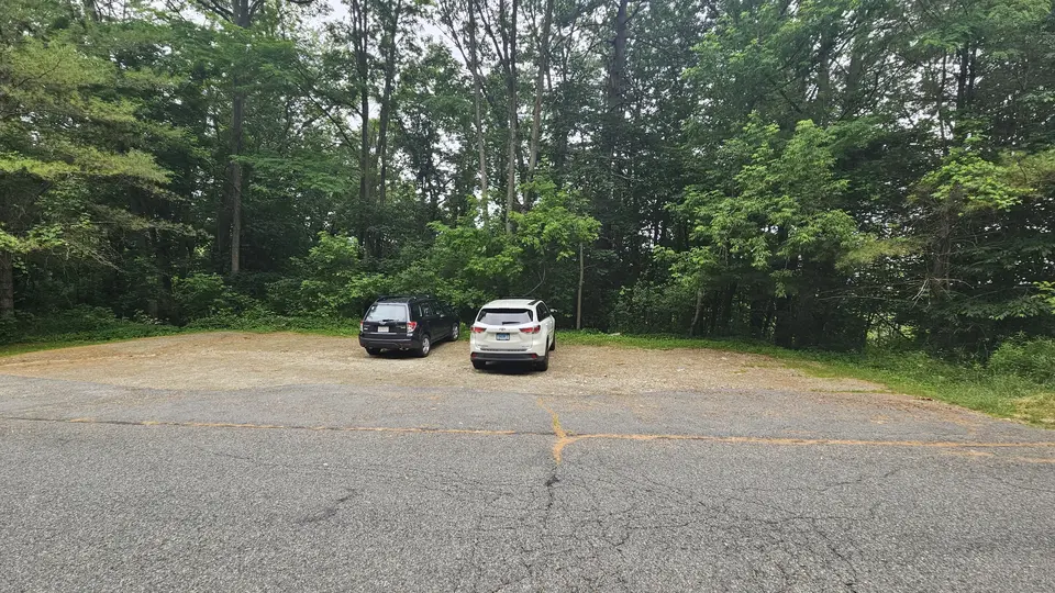 The gravel parking lot.