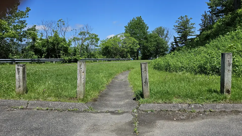 A parking lot's start to the path