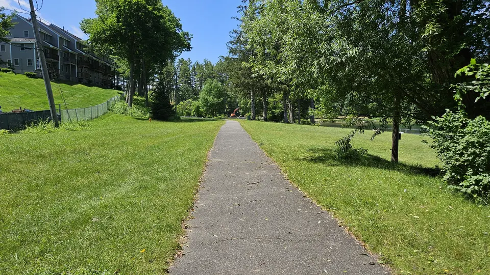 The path, goes around the grassy area with the boat launch