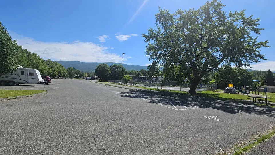 The parking lot, featuring a handicap spot (right).