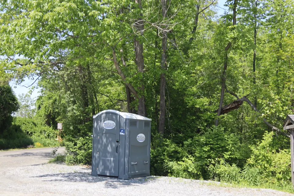Accessible portable restroom in the parking lot