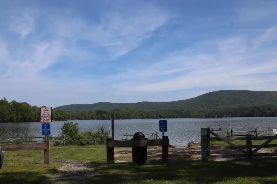Two accessible parking spots located adjacent to the beach.