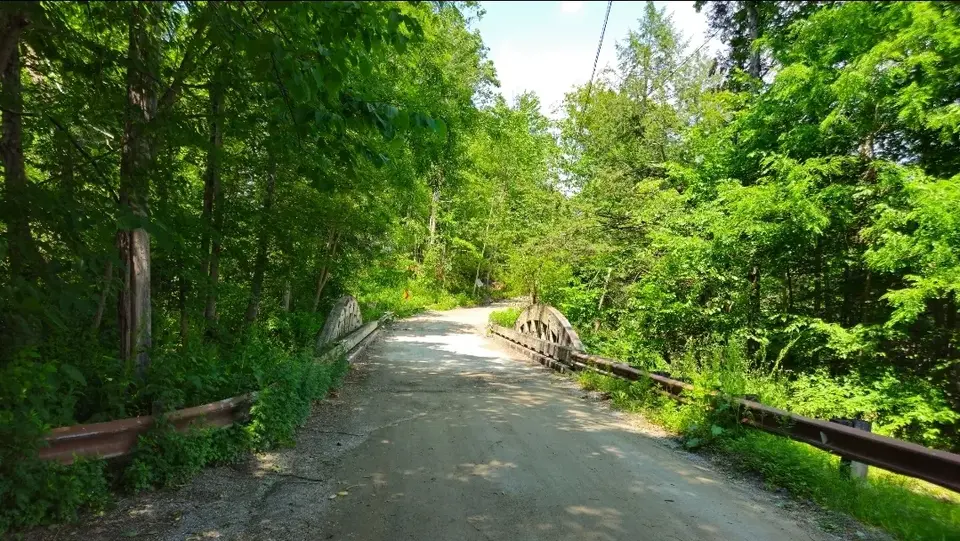 The bridge on the road by the parking lot