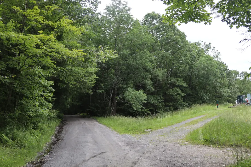 Silver Brook North Flood Control Site from Silverbrook Road facing southeast. Access to the boat ramp is to the sharp right, whereas access to the top of the reservoir is to the slight right. 