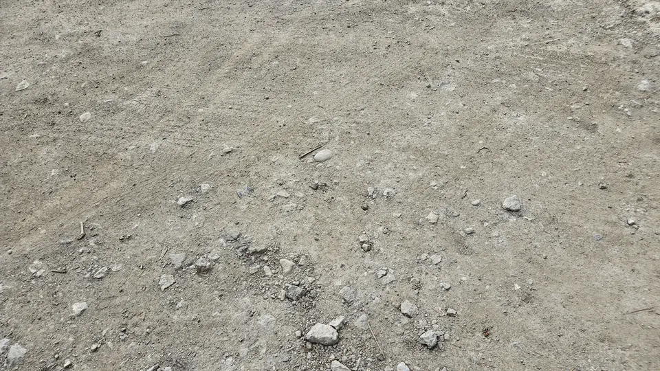 A close-up of the aggregate stones in the parking lot.