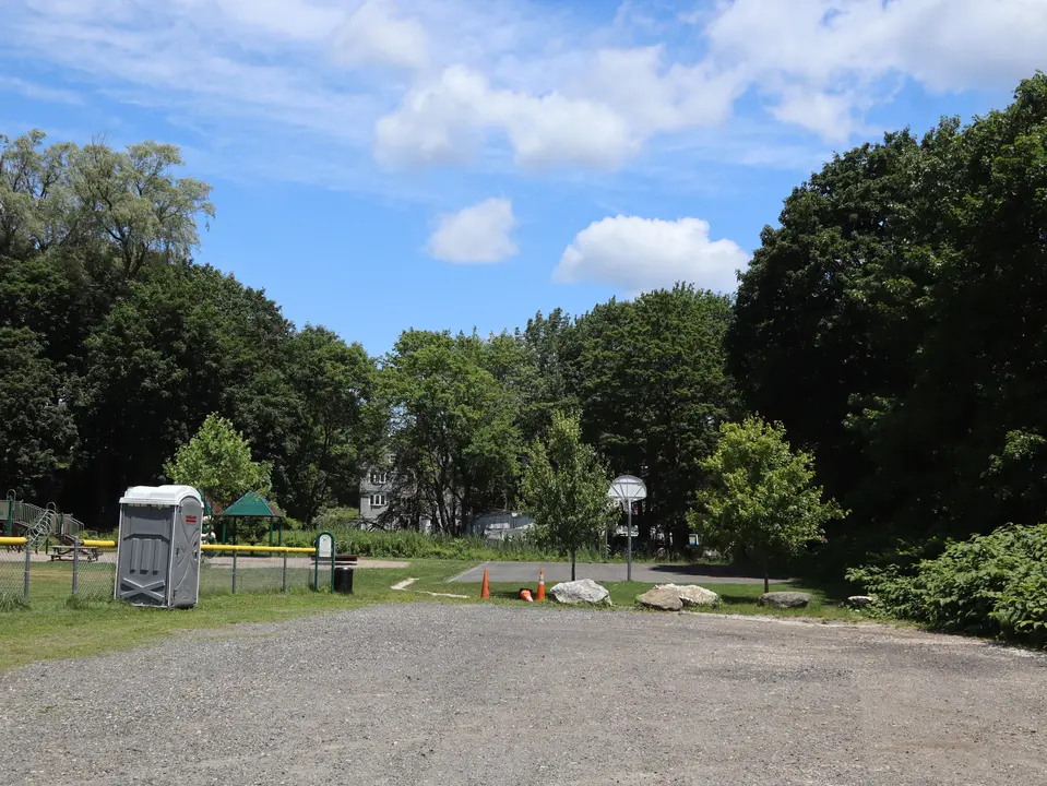 Parking area for Tillotson Park, over crushed gravel.