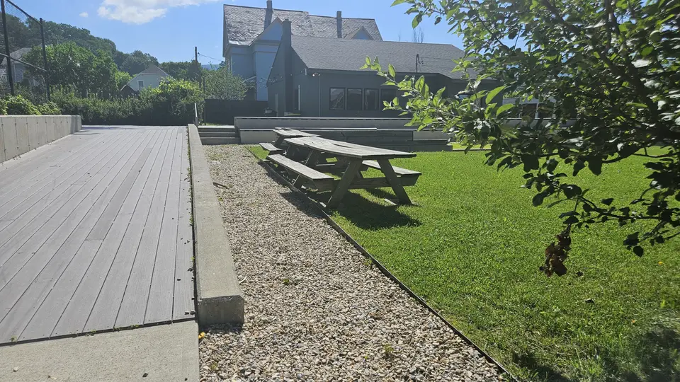 The picnic tables (right) and a ramp leading to the Uno Community Center (left)