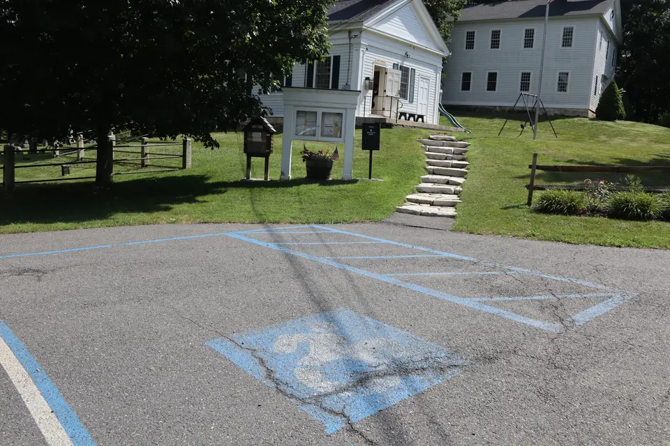 An accessible parking space provides close access to the Alford Town Office and Park.