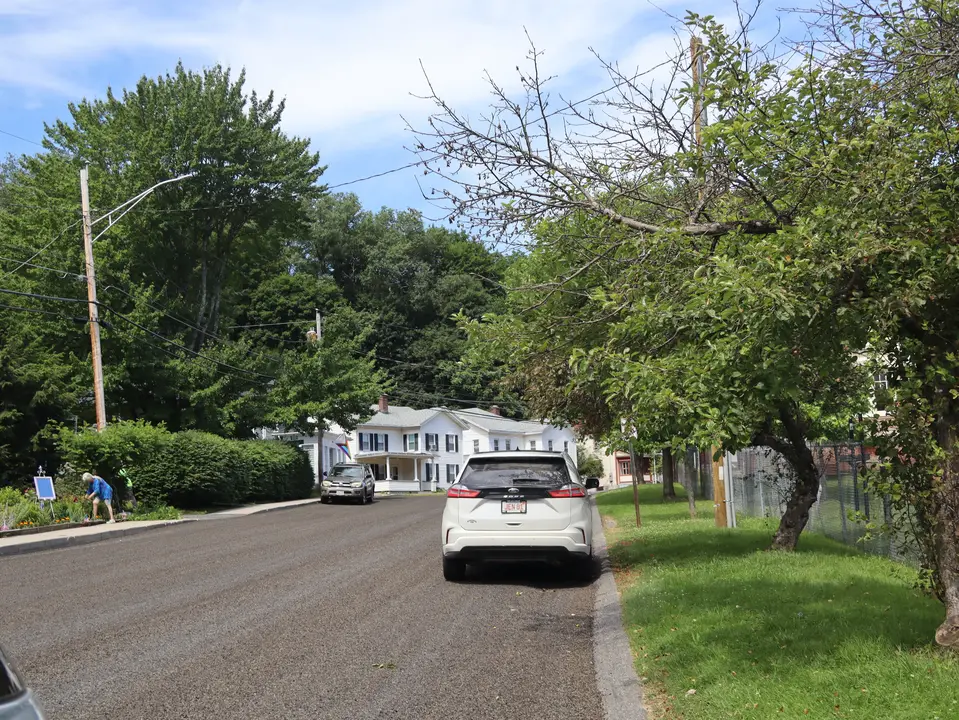Roadside parking area for Alice Bubriski Memorial Playground, from Pleasant Road.