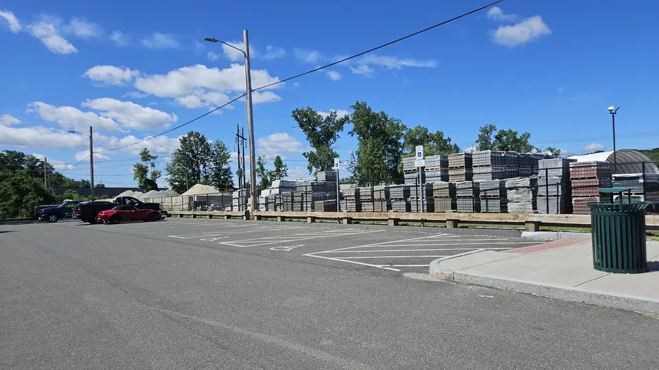 The parking lot with 2 designated handicap spots.