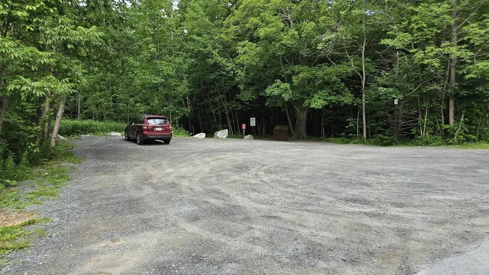 The dirt parking lot.