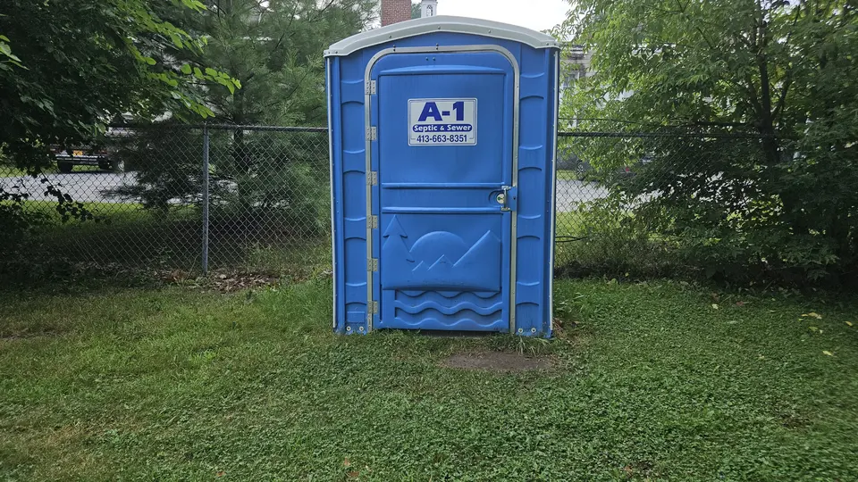 An accessible port-a-potty in the park.