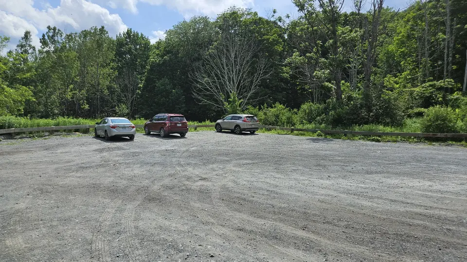 The dirt parking lot.