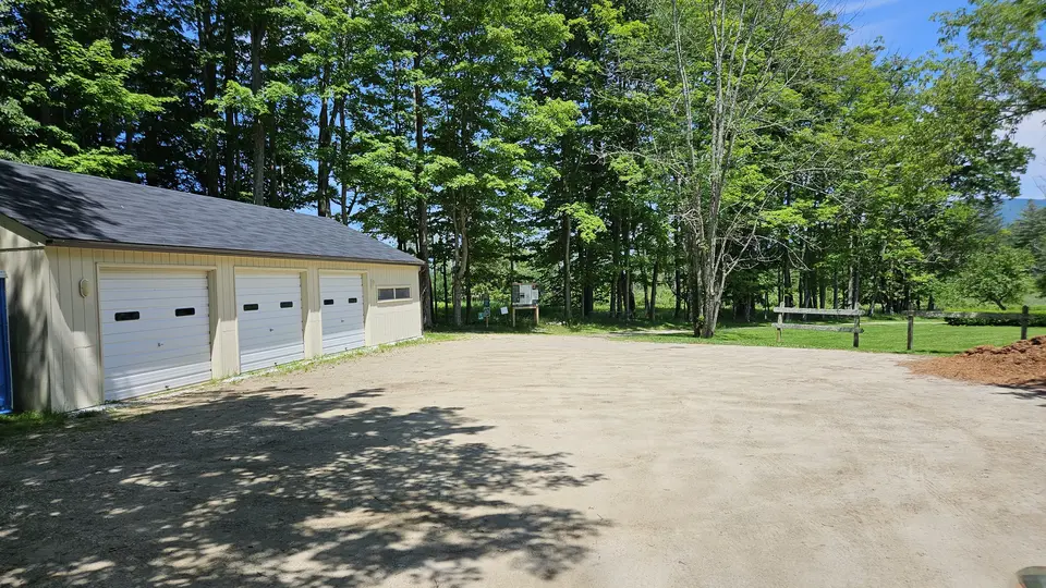 The packed dirt parking lot.