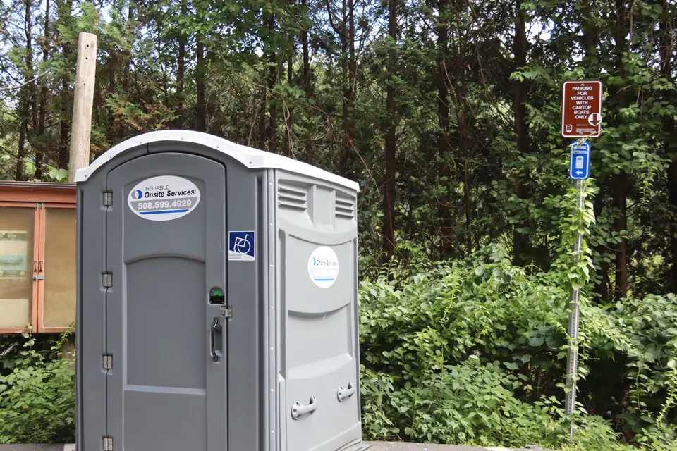 An accessible portable restroom located near the Goose Pond Boat Ramp.