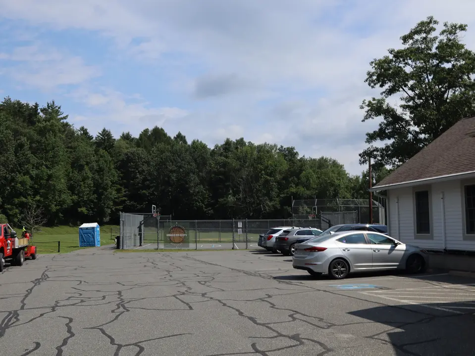 Flat, paved parking area for Greene Park.