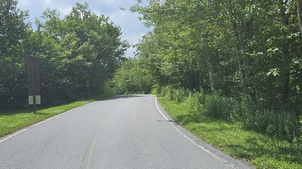 The road that leads to the parking lot.