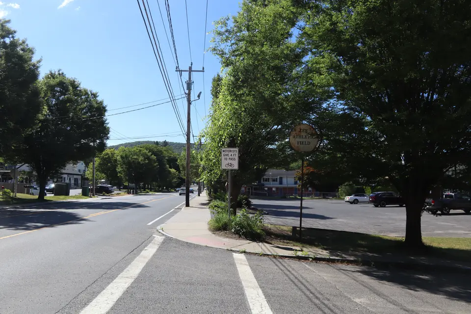 Entrance to the Lee Athletic Field (right) from Housatonic Street, facing South.