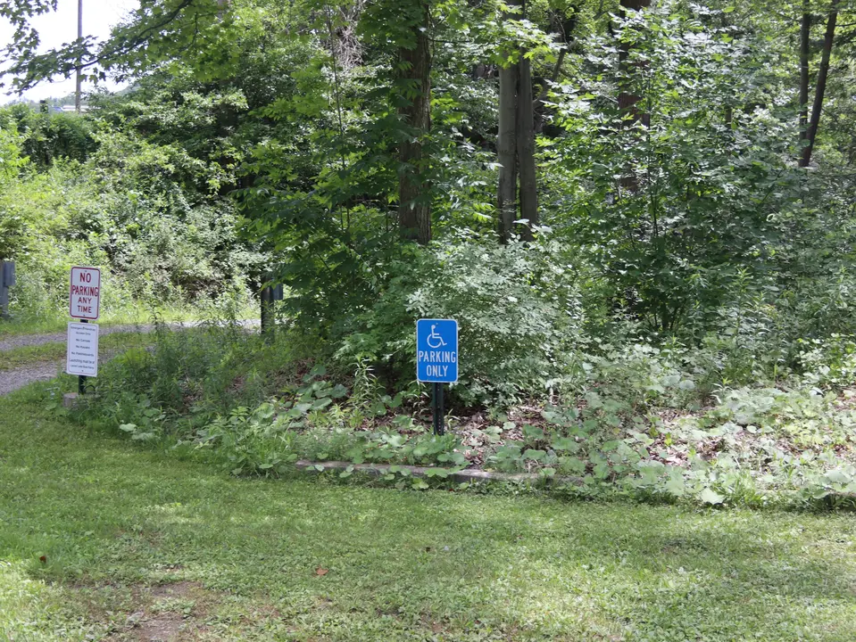 An accessible parking space in the main parking lot for Lenox Town Beach.
