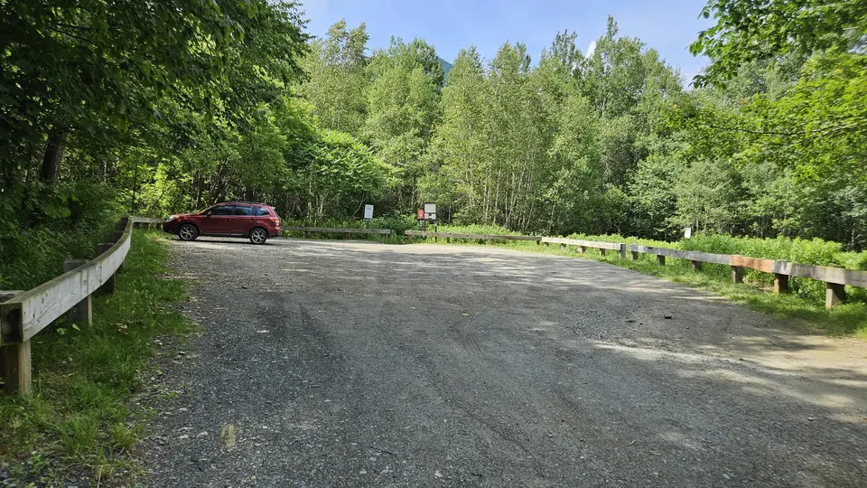 The dirt parking lot.