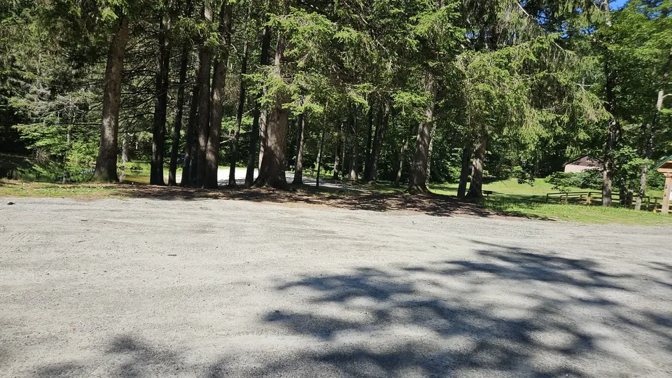 A large, flat gravel parking lot.