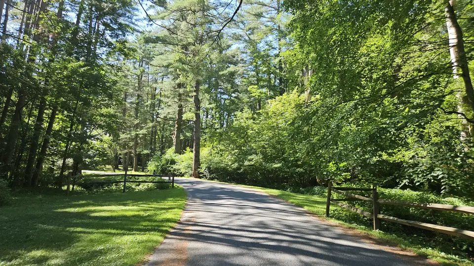 The road that leads to the parking lot.
