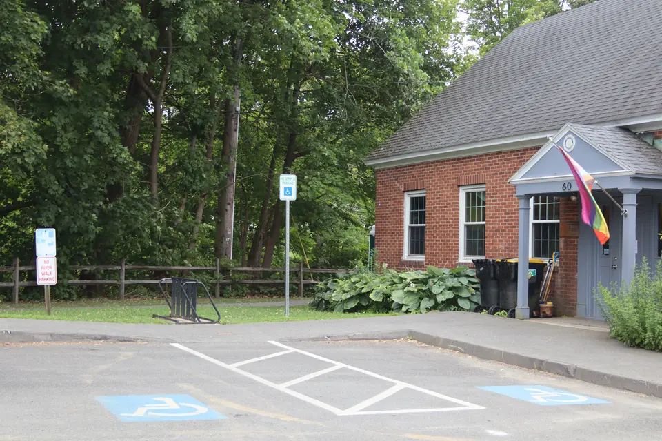 Two accessible parking spaces adjacent to memorial park.