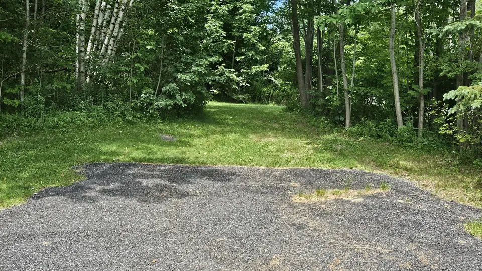 The small, paved parking area.