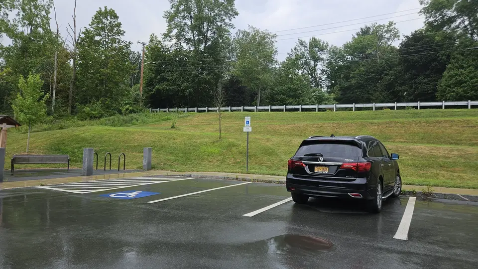 The parking lot with 1 designated handicap space.