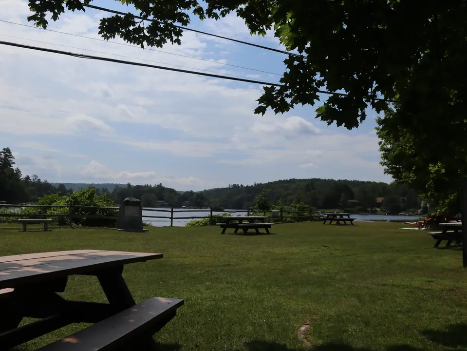 Accessible picnic tables overlook Lake Garfield at Monterey Town Beach.