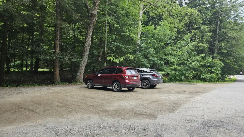 The gravel parking lot.