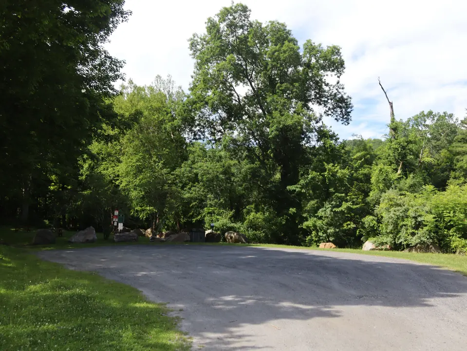 A small, level, gravel parking area for Old Maids Park.