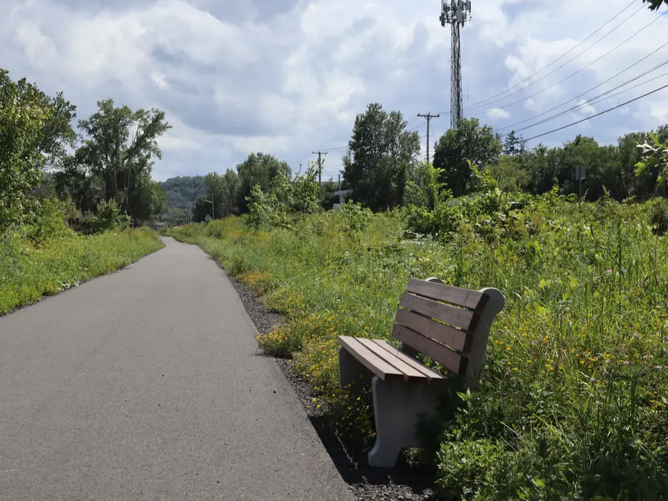 A bench alongside the Old Route 7 Greenway.