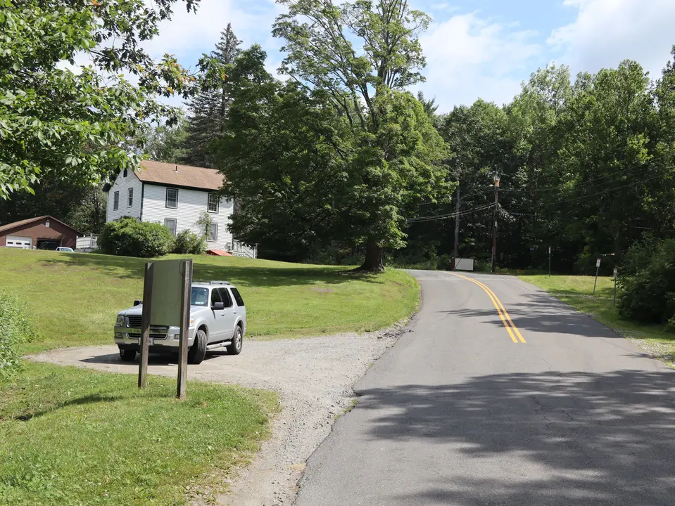 Parking area for Otis Reservoir Dam.
